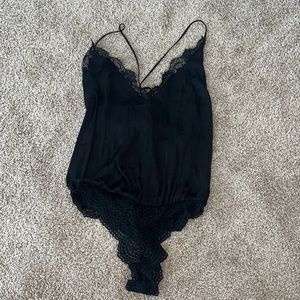Free people body suit with lace detail. Size small